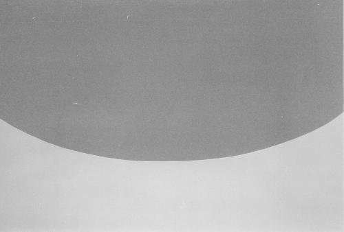 light and dark grey surfaces. one concave, one convex.